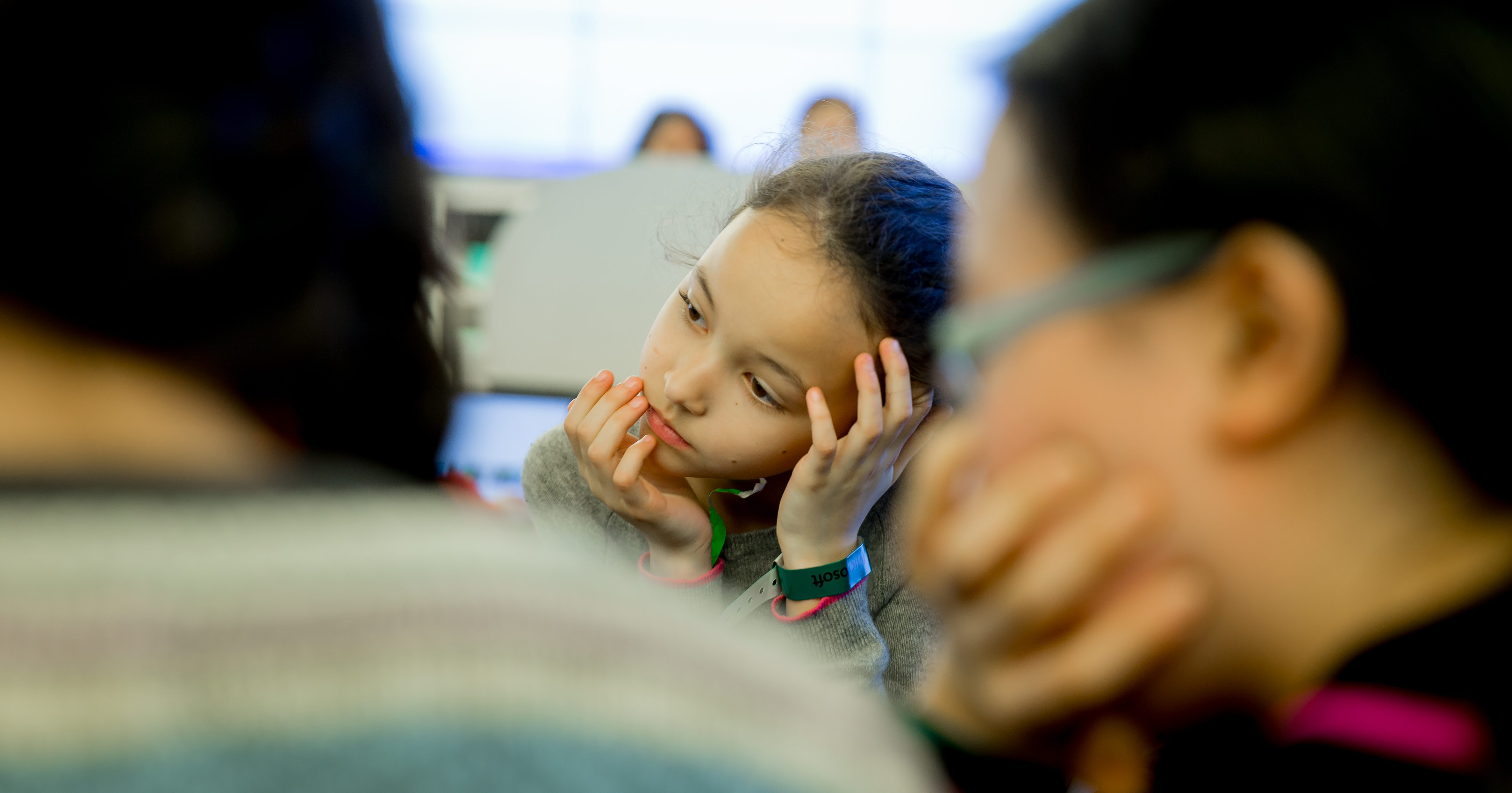 Photo of little girl listening to STEM presentation