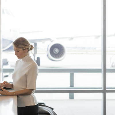 A woman uses a Surface tablet in an airport