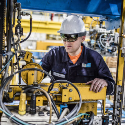 Engineers using HoloLens on the factory floor