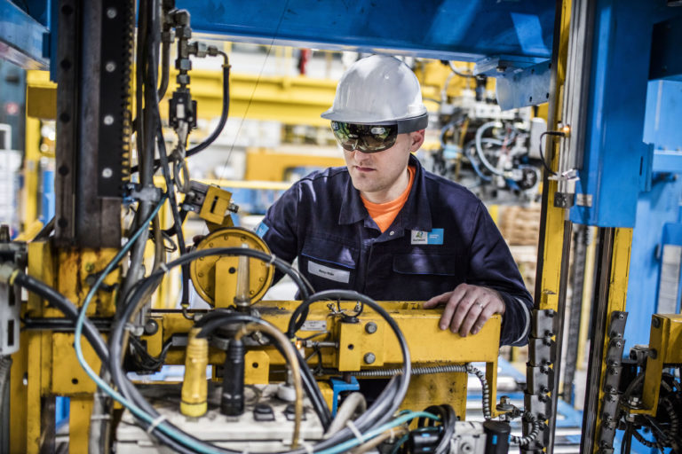 Engineers using HoloLens on the factory floor