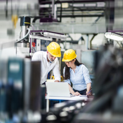 Engineers working hard on the factory floor