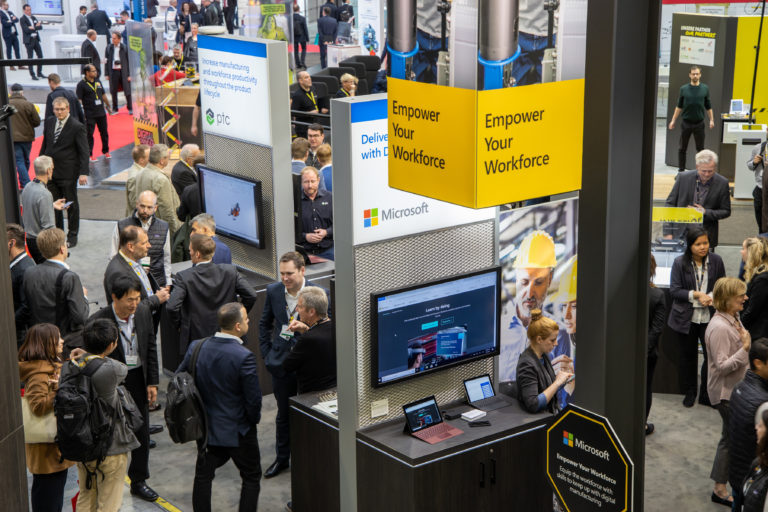 Attendees check out customer solutions in the Microsoft booth at Hannover Messe 2019