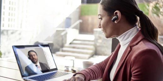 Woman meets with man on a laptop computer