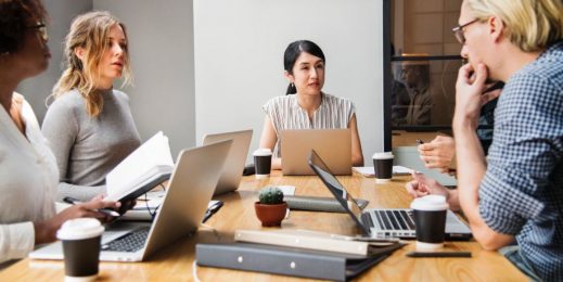 Five people in a meeting