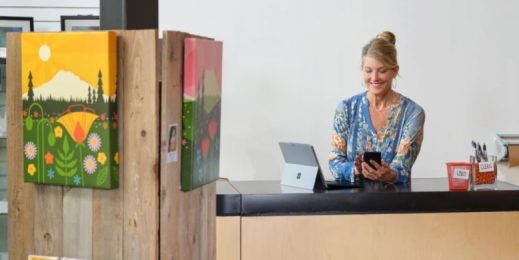 Cashier working on mobile devices at a store