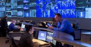 Four AT&T employees at work in the company's Operations Center