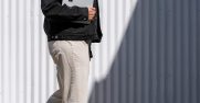 A woman holds a Surface laptop