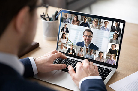 A businessman conducting a conference meeting on the web.