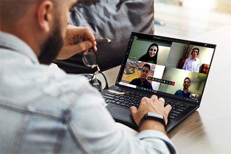 Businessman conducting a Teams conference call from home.