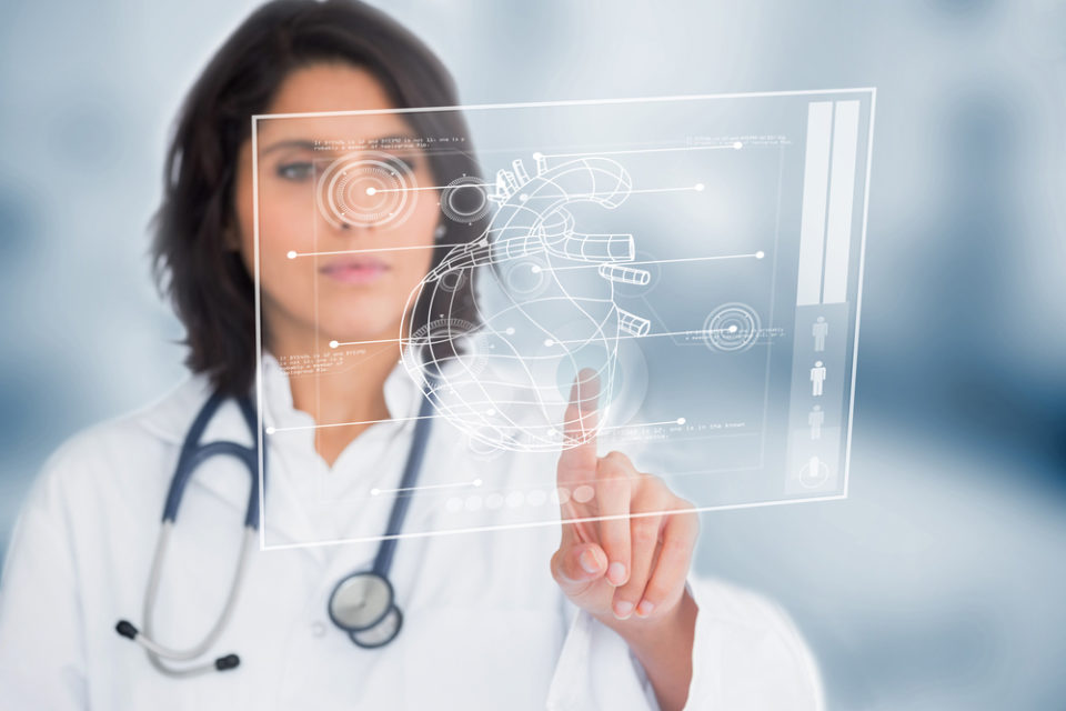 A medical doctor analysing patient data on a holographic device.