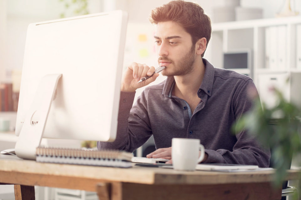 Middle Eastern student working online from home.