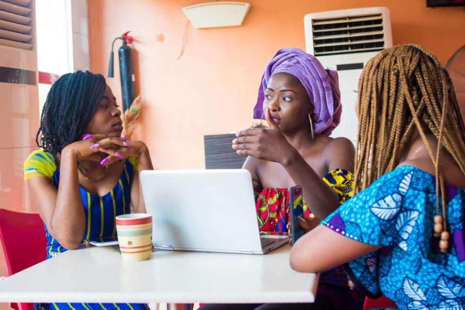 Women having a discussion around a table