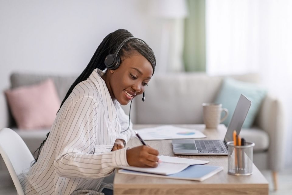 young woman working on lap top