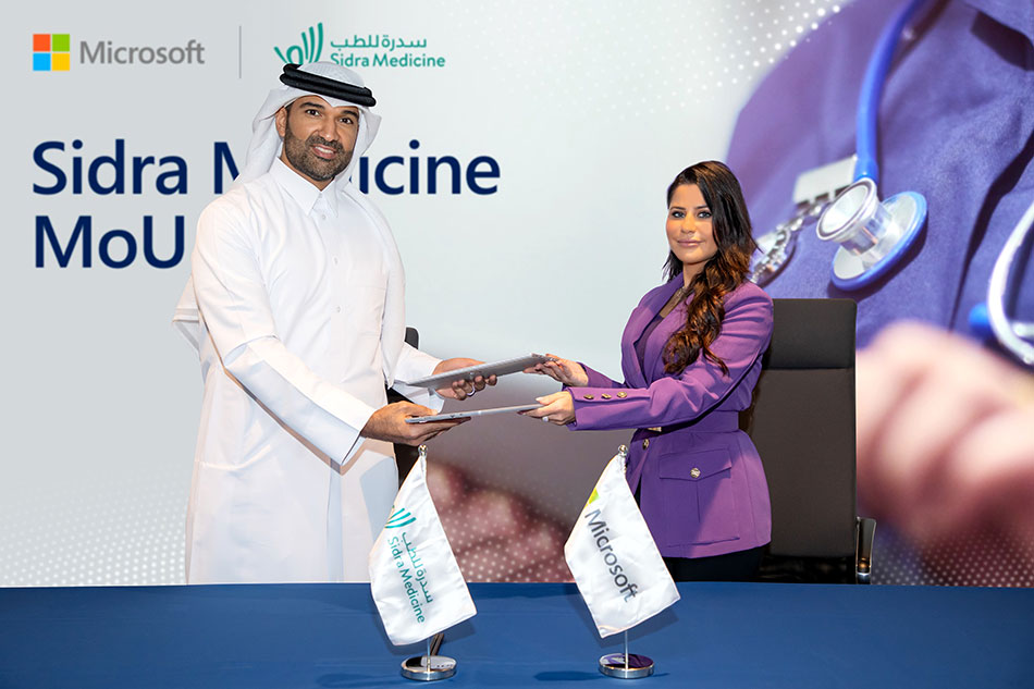 Dr. Khalid Fakhro and Lana Khalaf signing the MoU