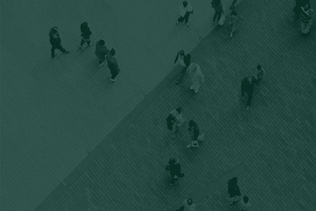 A bird’s eye view of people walking on a busy street