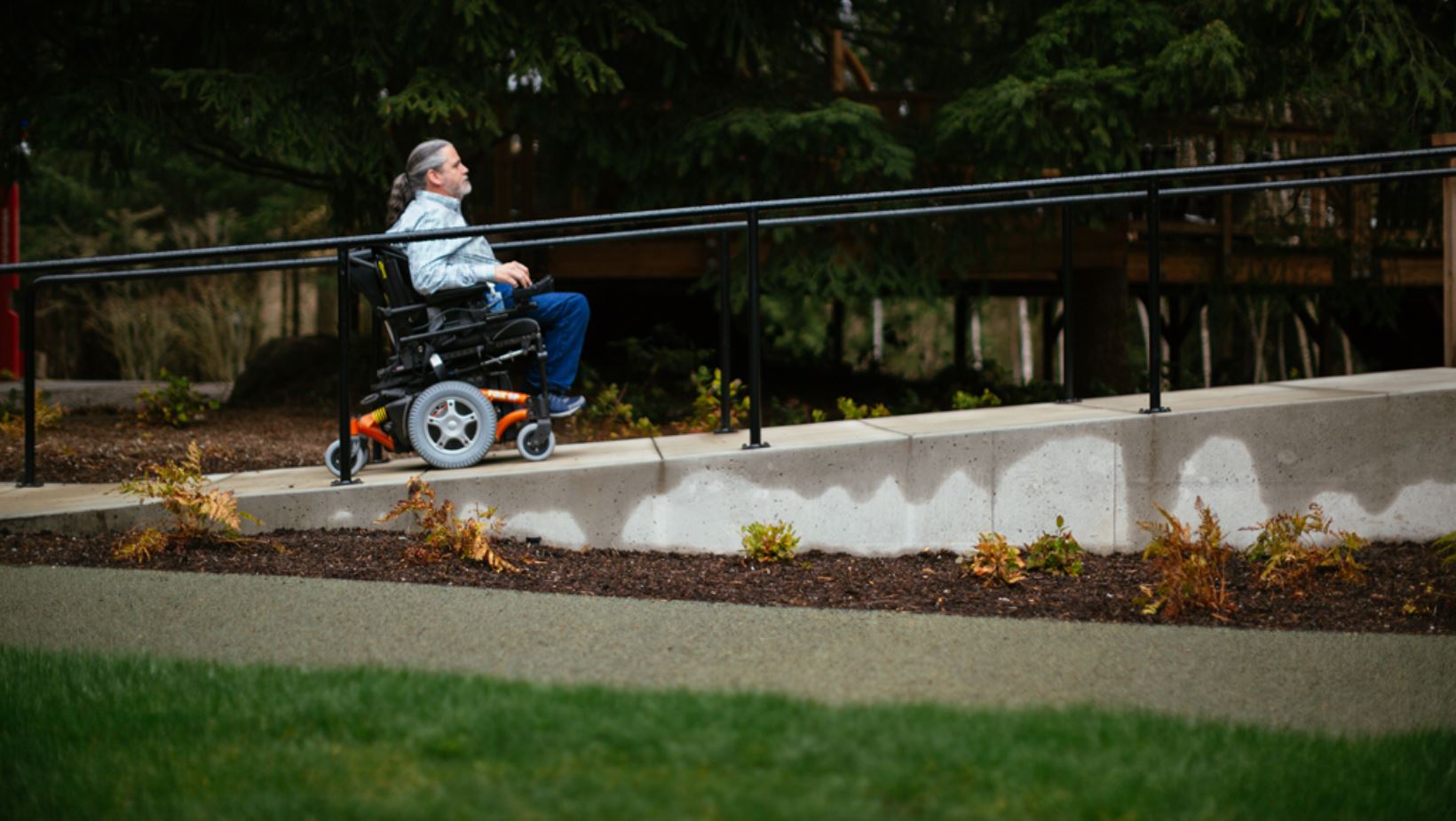 A man on wheelchair going up the hill