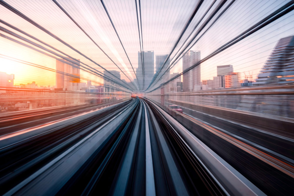 long exposure of a rail line with Tokyo in the distance