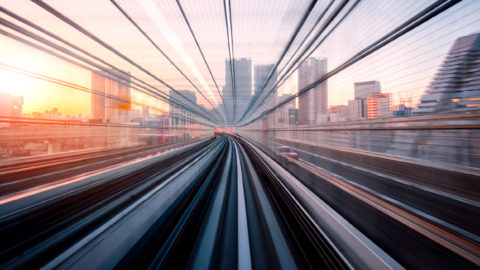 long exposure of a rail line with Tokyo in the distance