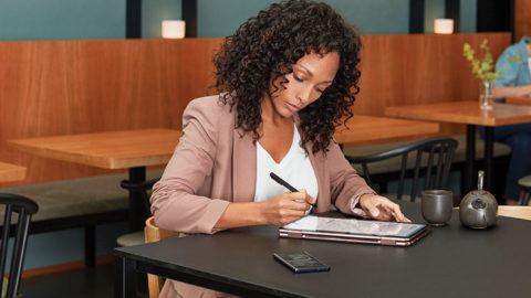 A woman works on a tablet