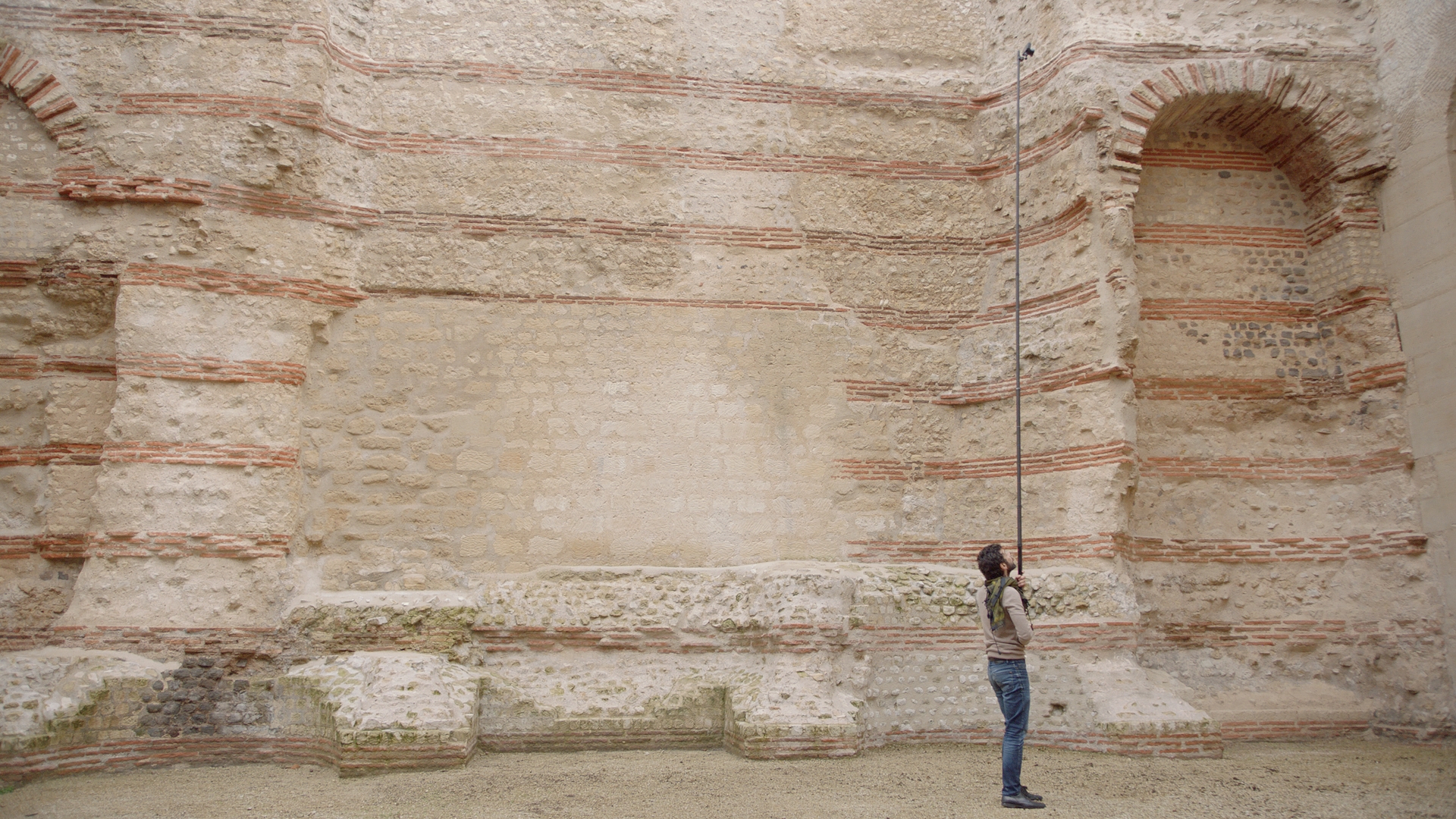 Man works with equipment on ancient site