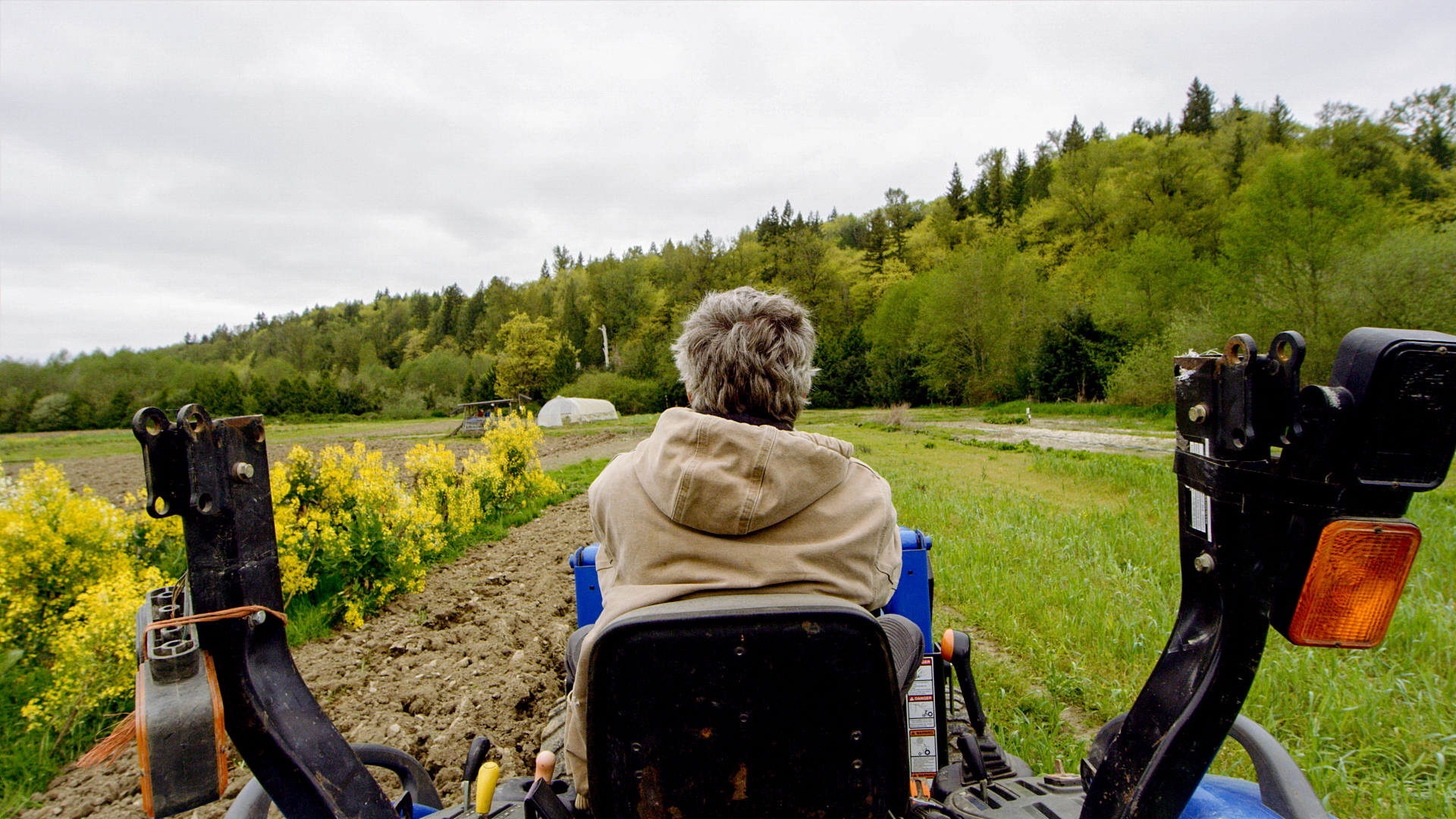 Farmer Sean Stratman on a tractor on his farm