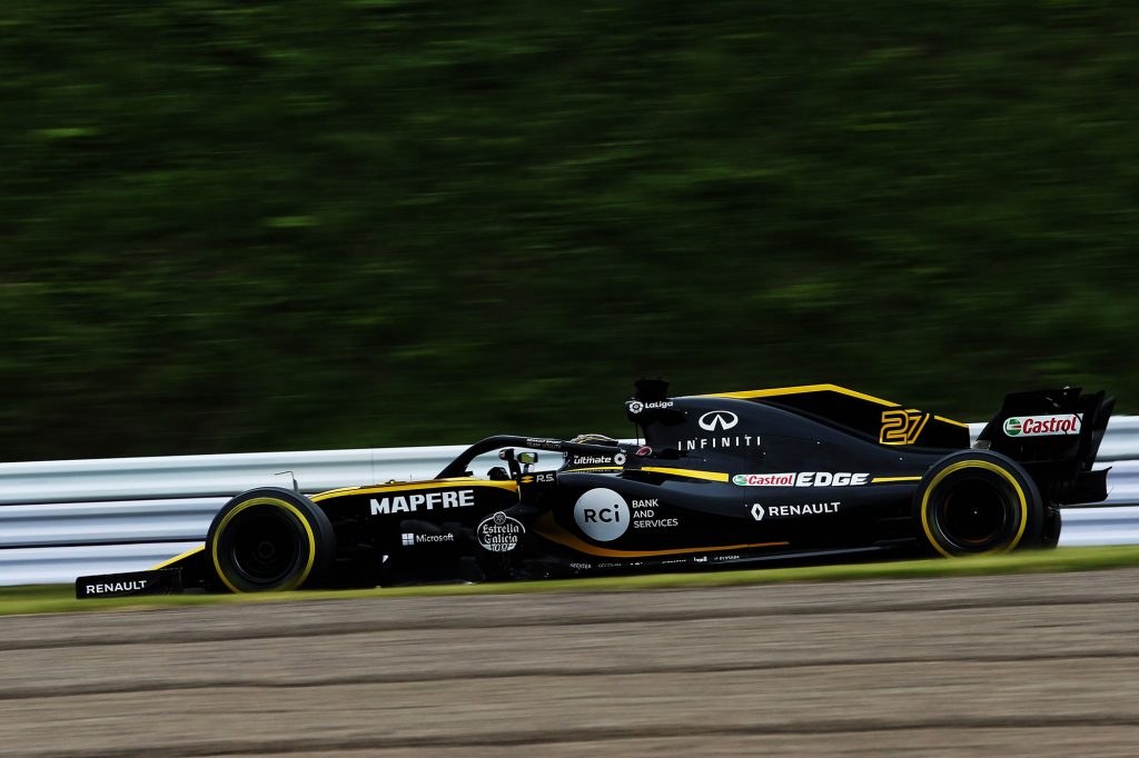 black race car on a track