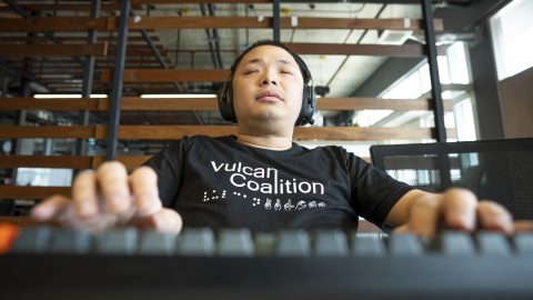 Vulcan Coalition software engineer Punnaphoj Aeuepalisa works on a keyboard