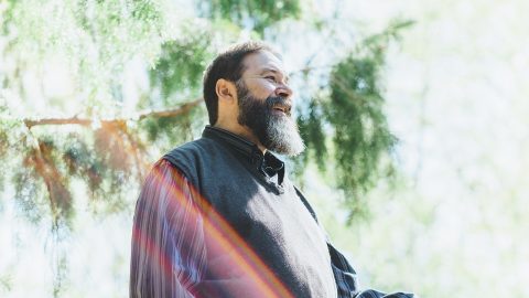 Microsoft employee Lewis Curtis standing outside beneath trees