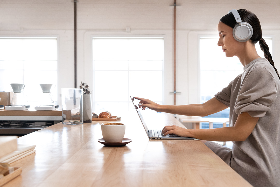 Women using Surface Headphones.