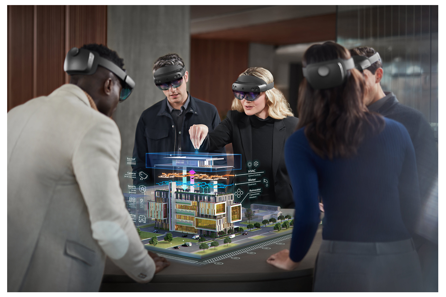 Ein Projektteam testet eine Projektion (HoloLens) mit VR Brillen