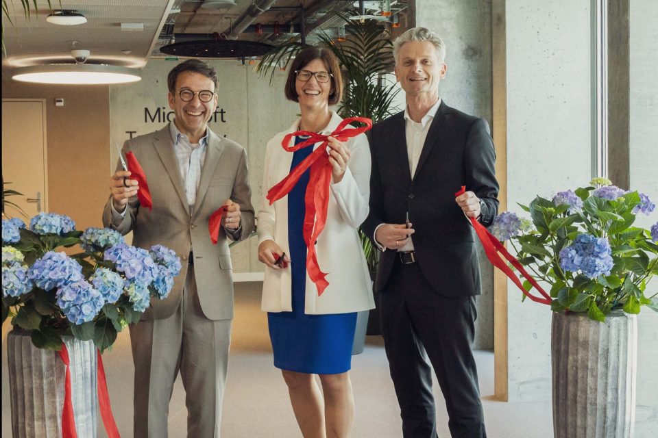 Judson Althoff, Catrin Hinkel and Ralph Haupter Cutting a red ribbon to officially open the MTC.