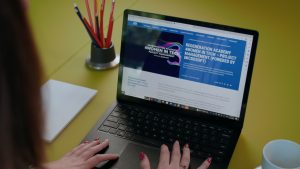 Woman typing on laptop