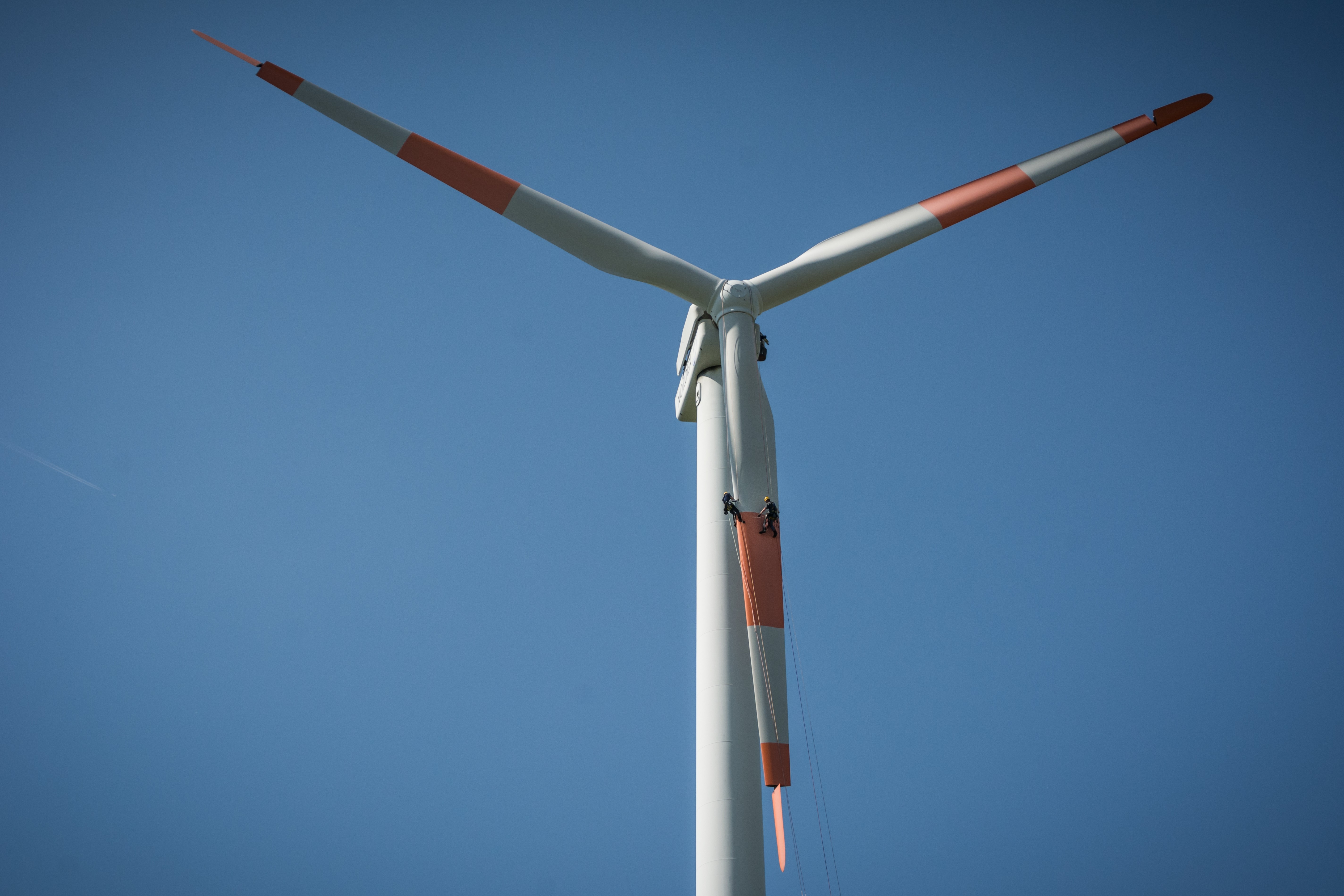 Spot the worker: Wind turbine inspectors look tiny compared to the massive towers that they need to climb and physically inspect