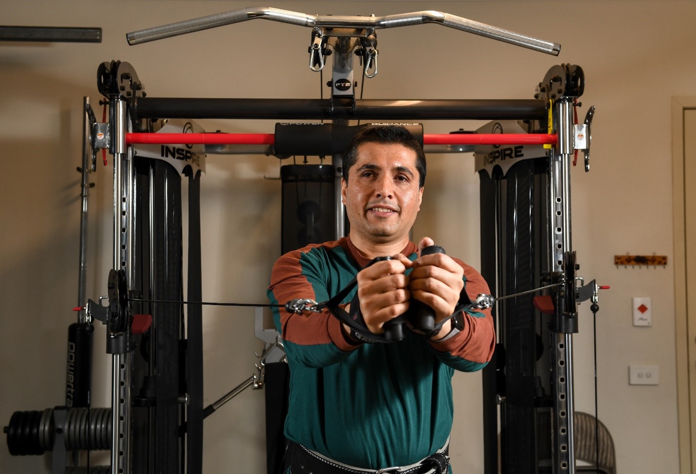 Man on a exercise machine in a gym