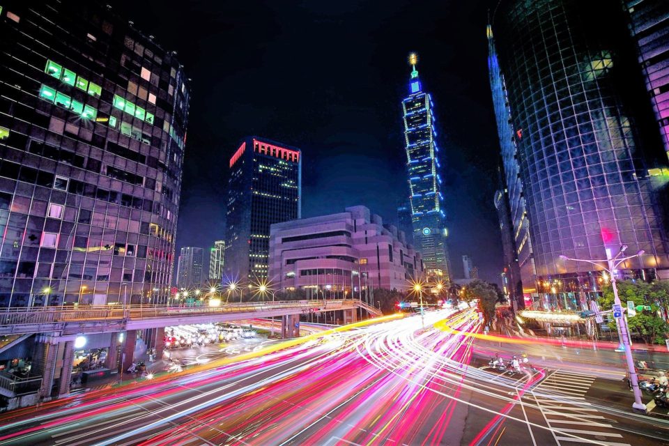 A busy street at night in Taipei