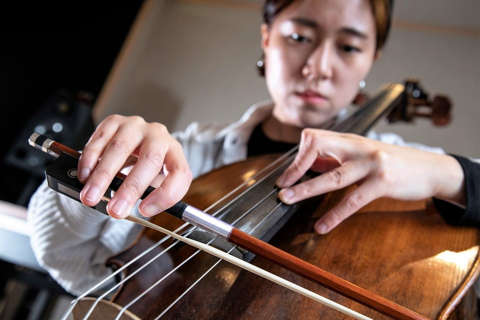 A woman plays a cello