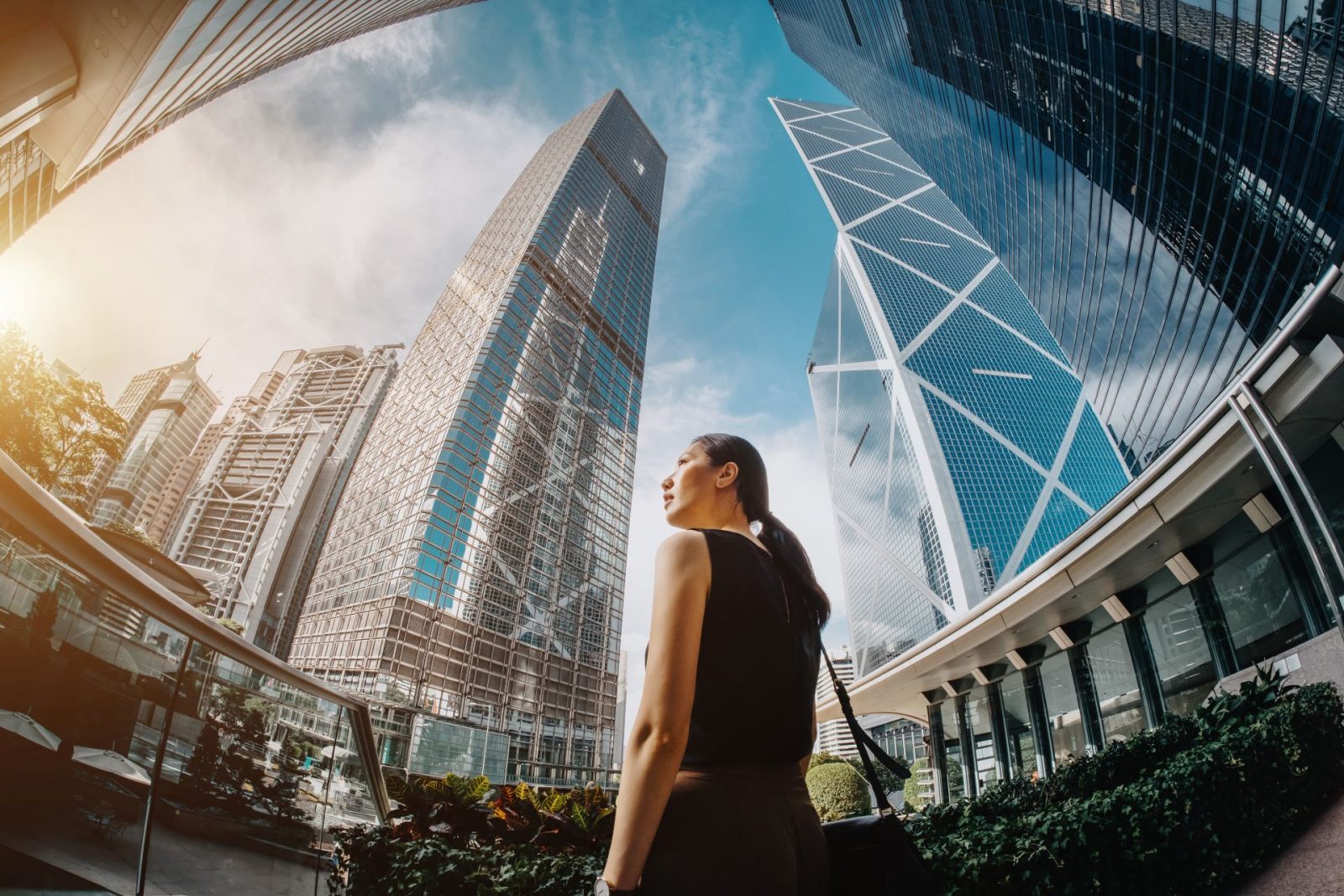 woman standing amongst skyscrapers