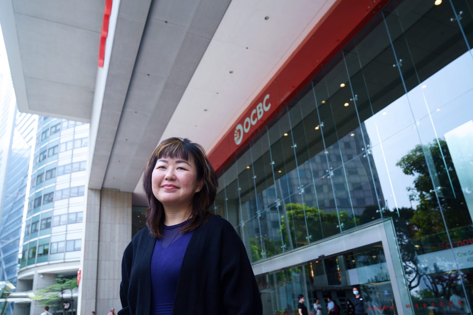 A woman standing in front of a building