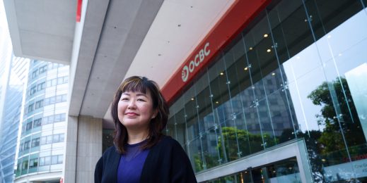 A woman standing in front of a building