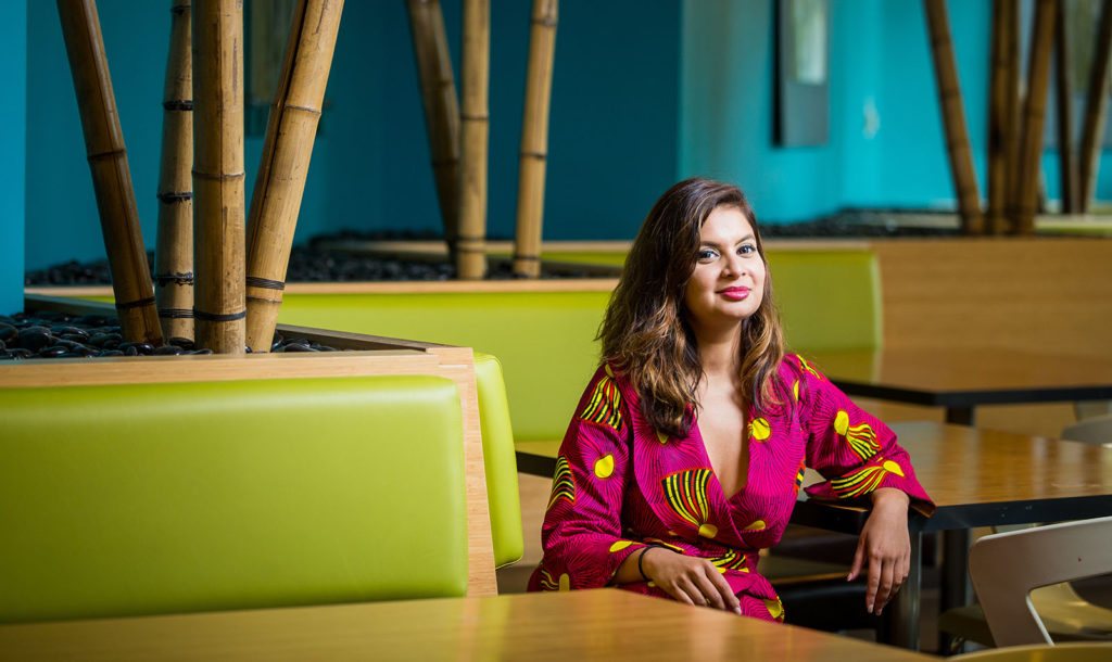 a sitting at a booth