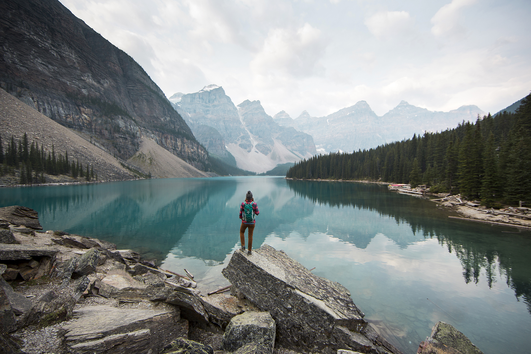 Person standing in front of lake