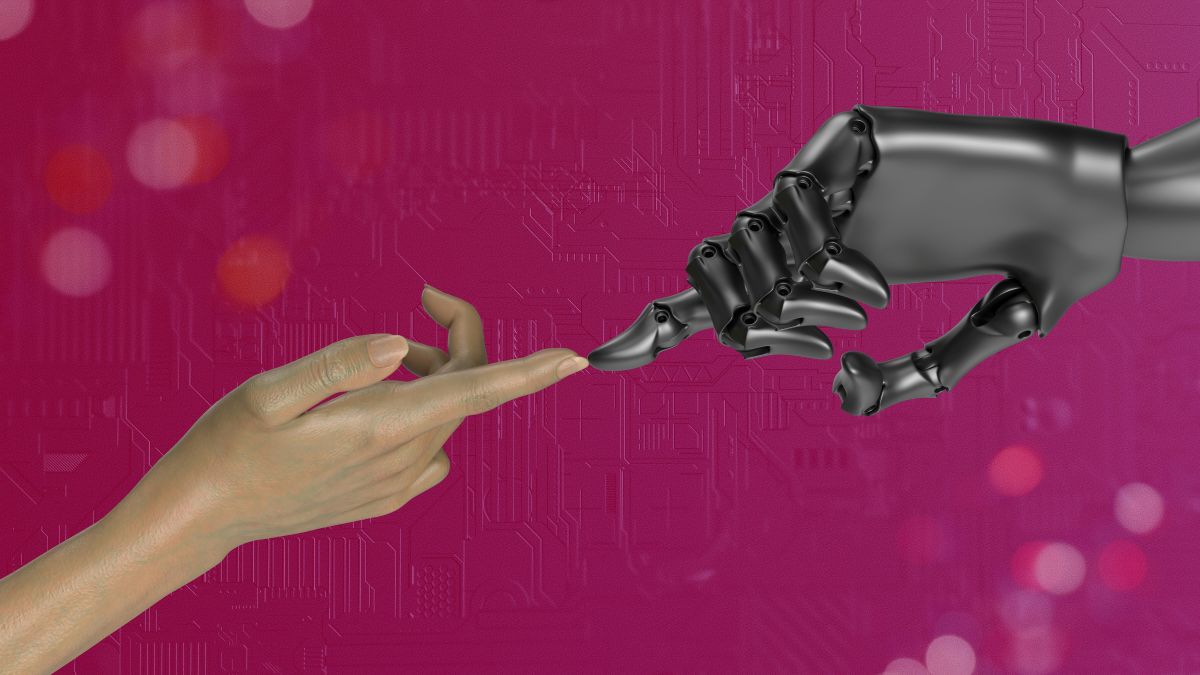 A human finger touching a robotic finger