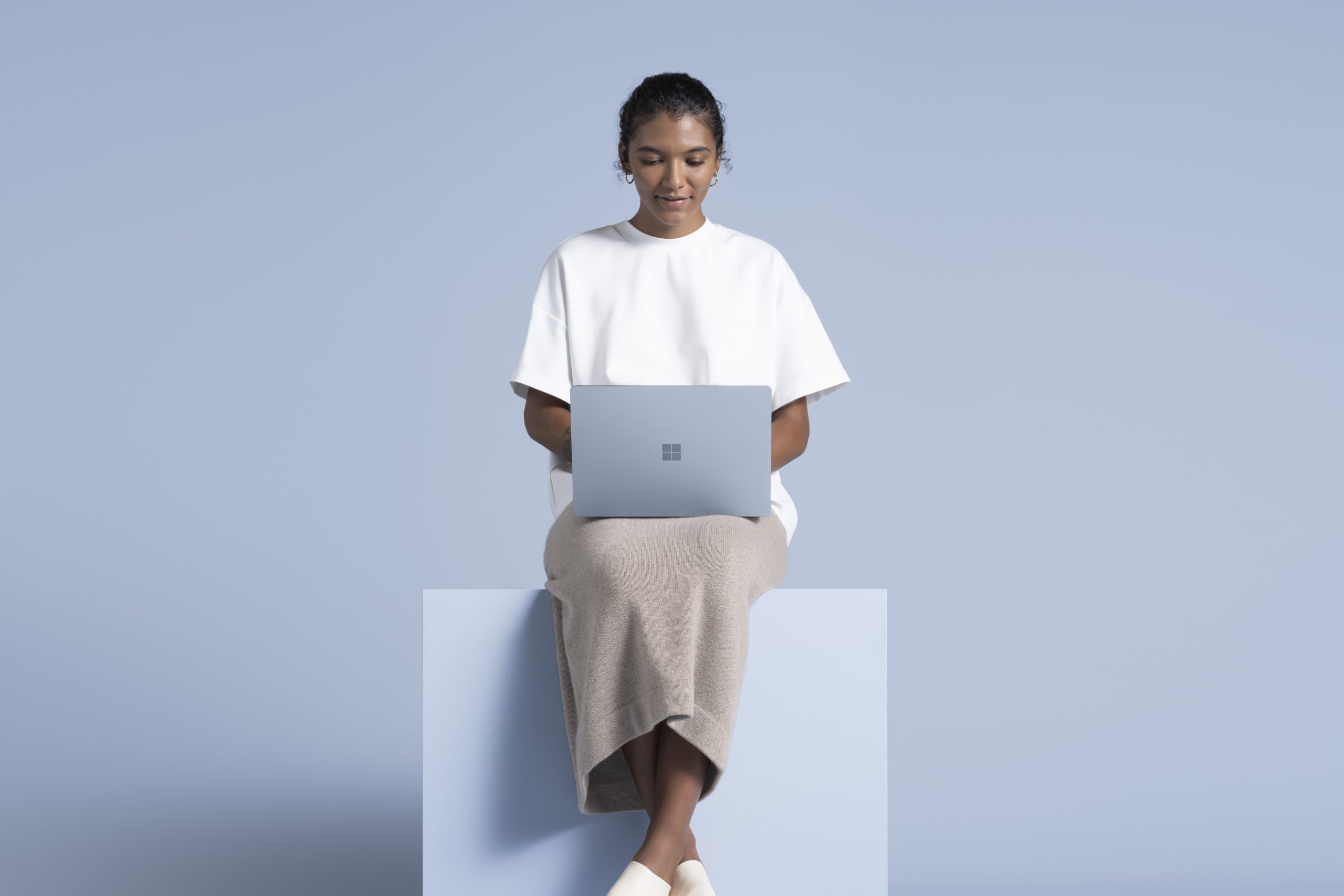 Woman with Surface device