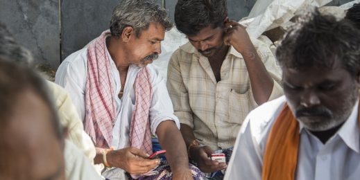 Farmer looking at their mobile phones