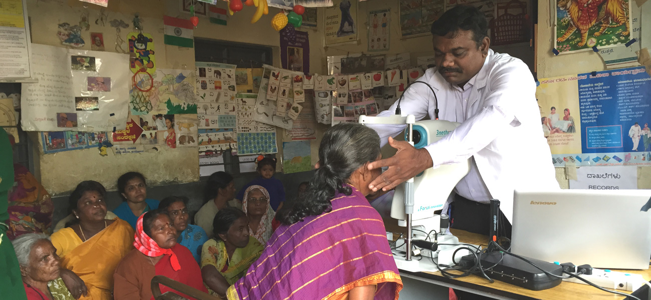 Locals get their eyes examined at an eye check-up camp in a remote location.