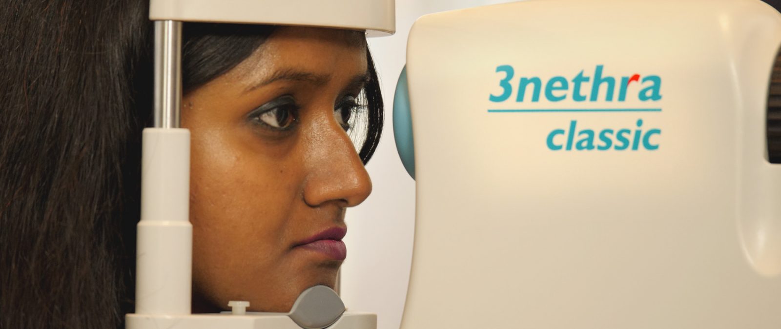 Patient being examined for diabetic retinopathy using Forus Health's 3Nethra device.