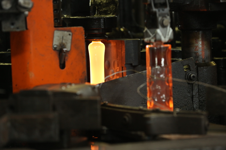 a glass bottle being manufactured