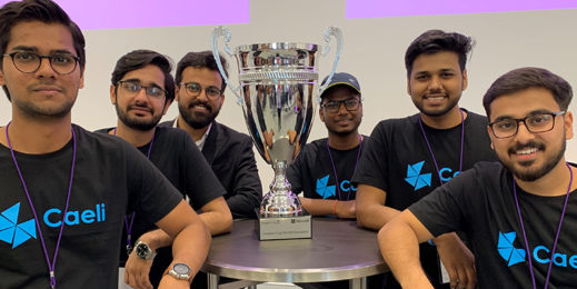 a group of boys pose with a trophy