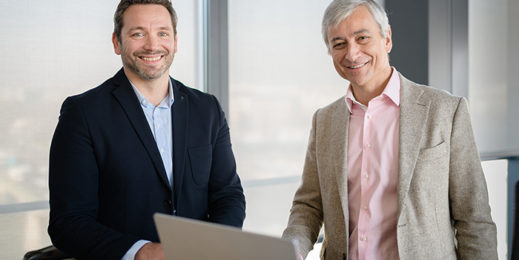 Two gentlemen looking at the camera