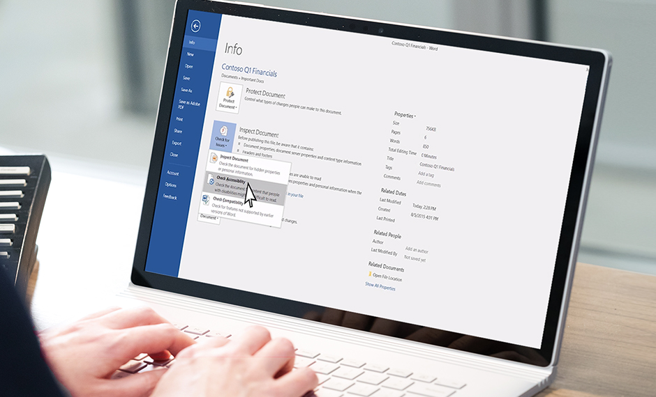 A user is clicking on the Çheck Accessibility feature of MS Word. The title of the document reads Contoso Q1 Financials